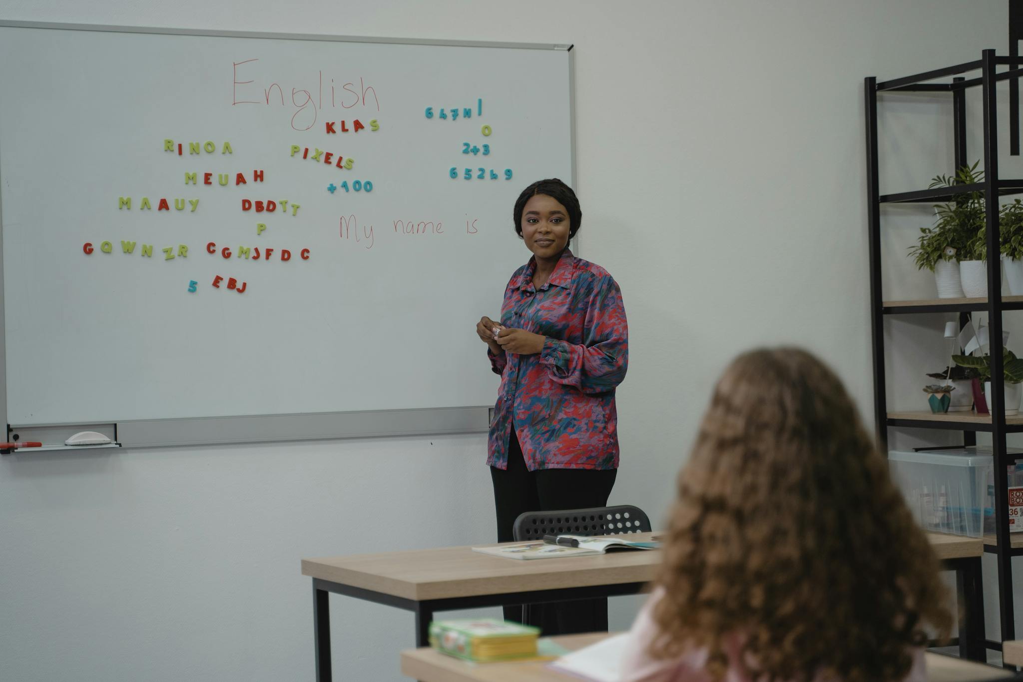 Our Mission 1 a teacher explaining english concepts to a